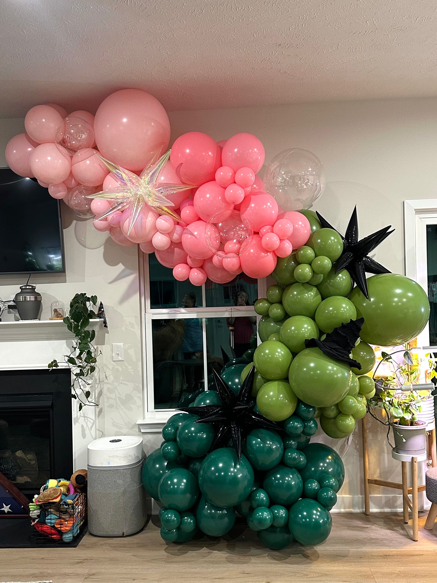 Wicked movie themed balloon garland with bubble balloons and witch's hat.